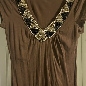 Shirt with beaded neckline